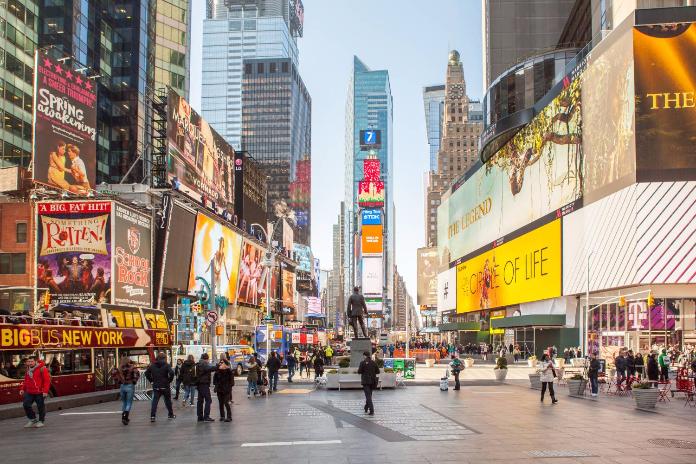 NEW YORK CITY - FEB 13: Shopping Street At 5th Avenue In NYC With Tourists  On February 13, 2015. It Is Considered Among The Most Expensive And Best  Shopping Streets In The